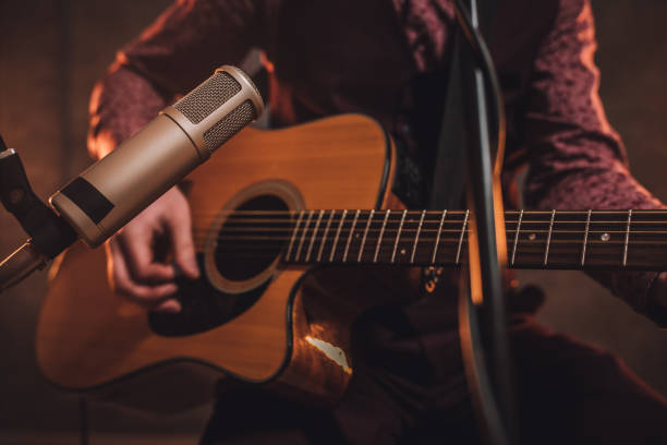 istock Rock musician playing acoustic guitar 1127384831