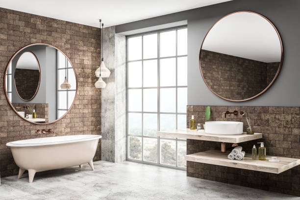 istock Brick bathroom corner, tub and sink close up 1127385724