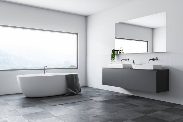 istock White bathroom corner, tub and sink 1127385849