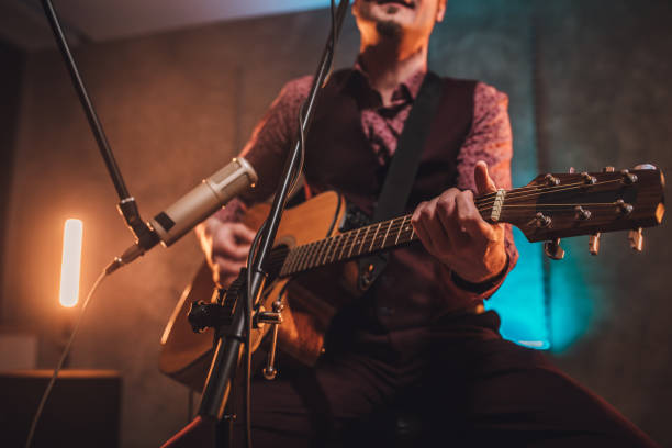istock Musician playing acoustic guitar 1127385850
