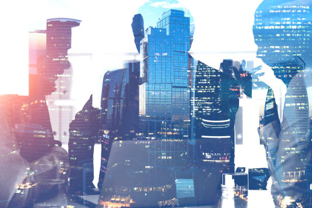 istock Silhouettes of colleagues working in office 1127386991