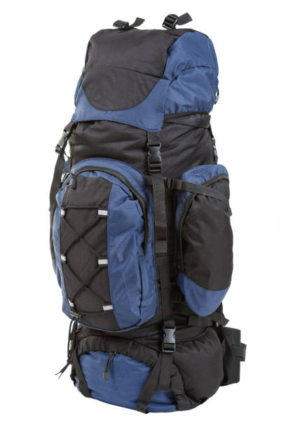 istock a large black backpack with blue accents, filled with things, stands on a white background 1127387598
