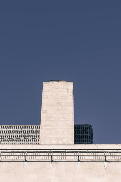 istock Gable wall and chimney clad in limestone of a modern office building 1127387675