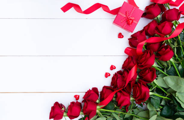 istock Red roses and Valentines day present 1127393594