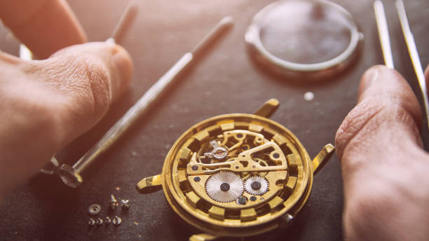 istock Process of installing a part on a mechanical watch, watch repair 1127393939