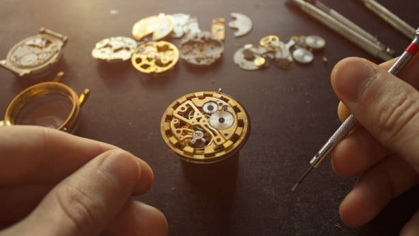 istock Process of installing a part on a mechanical watch, watch repair 1127393947