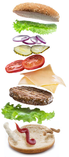 istock Hamburger ingredients falling down one by one to create a perfect meal. 1127395776