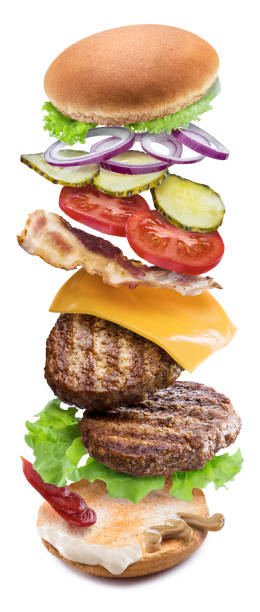 istock Hamburger ingredients falling down one by one to create a perfect meal. 1127395778