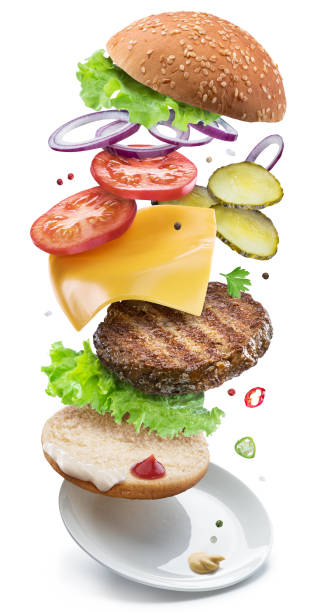 istock Hamburger ingredients falling down one by one to create a perfect meal. 1127395845