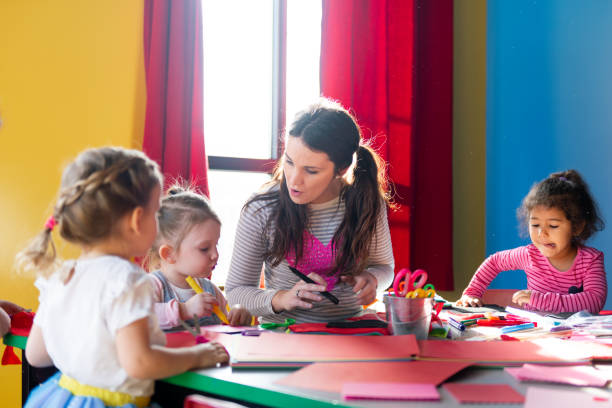 istock Children and educator preparing Valentine's day 1127398323