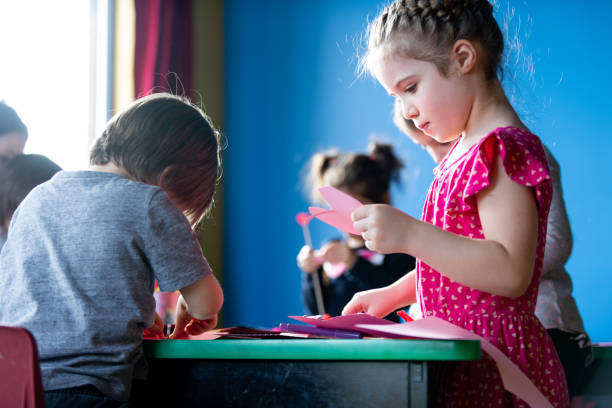 istock Children and educator preparing Valentine's day 1127398656