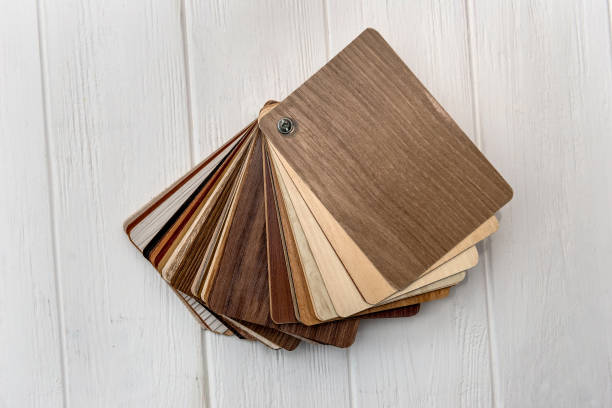 istock Textured wooden samples of different colours on light background 1127400202