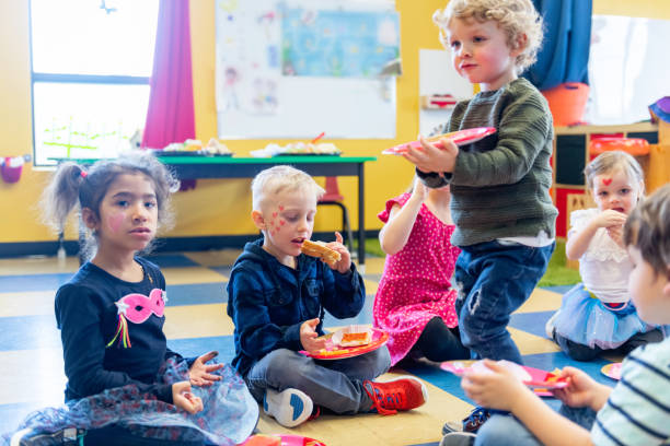 istock Children and educator preparing Valentine's day 1127400825