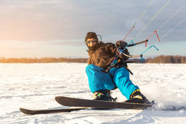 istock The skier goes on the snow field with kite 1127401046