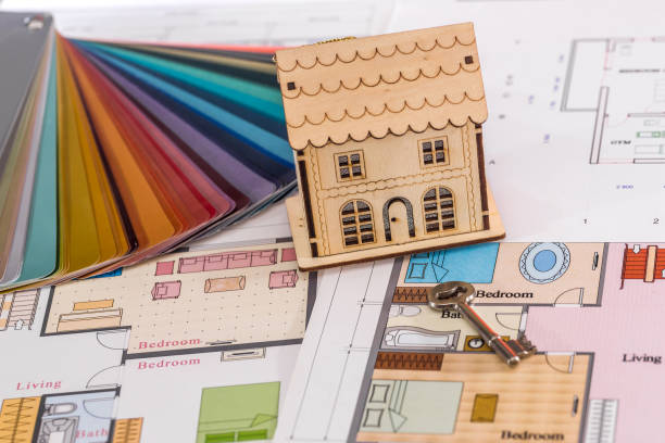 istock Wooden house on project with real key, closeup 1127401254