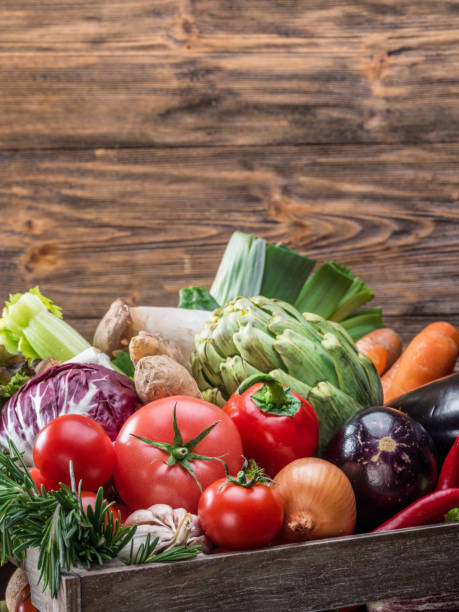 istock Fresh multi-colored vegetables in wooden crate. 1127402114