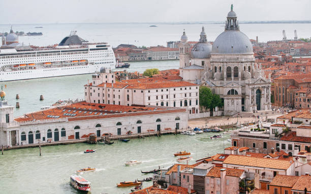 The Busy City of Venice: Cruise Ship and Santa Maria della Salute stock photo