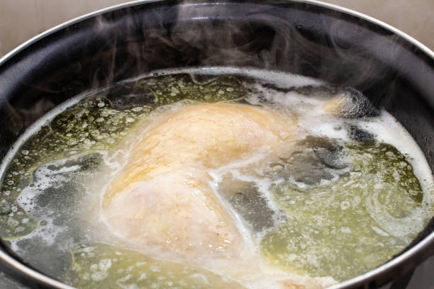 istock boiled chicken in a pot broth close-up with blurred background and front 1127405928