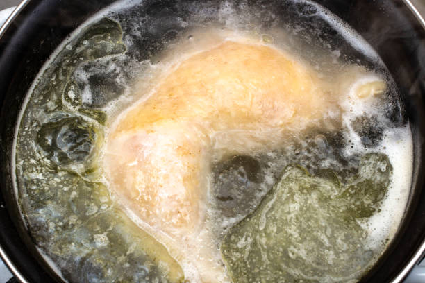 istock boiled chicken in a pot broth close-up with blurred background and front 1127405967