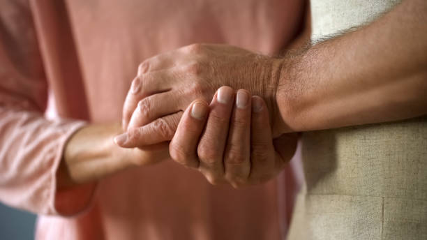 istock Retired couple holding hands, love connection, elderly husband and wife support 1127406213