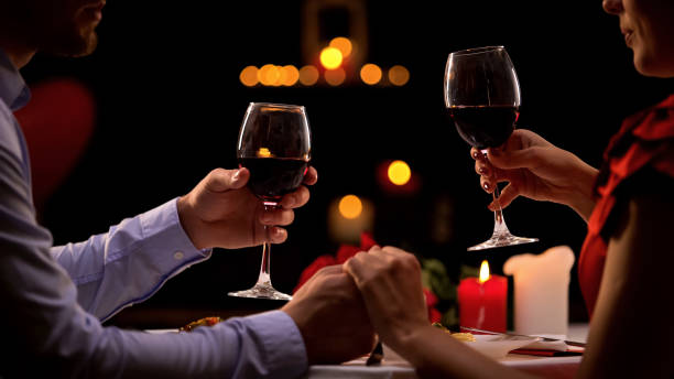 istock Couple tasting red wine in high-quality restaurant, winemaking traditions, date 1127406306