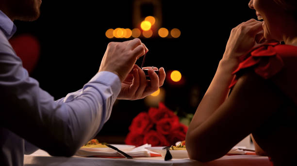 istock Man proposing beloved lady at romantic dinner in restaurant on st Valentines day 1127406358