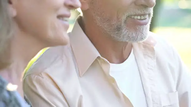 Happy senior couple smiling, healthy teeth, dental implants, prosthetics