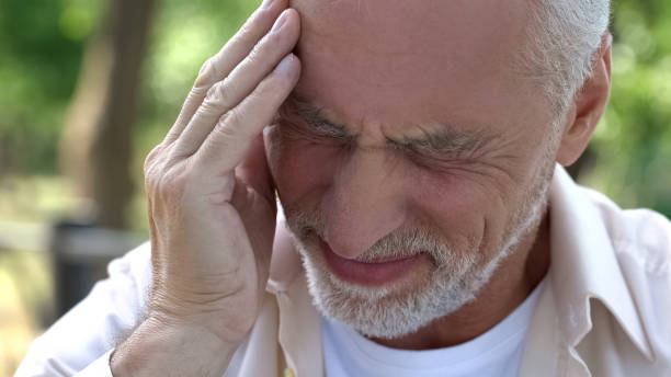 istock Senior man suffering headache, migraine attack during walk, risk of thrombus 1127406445
