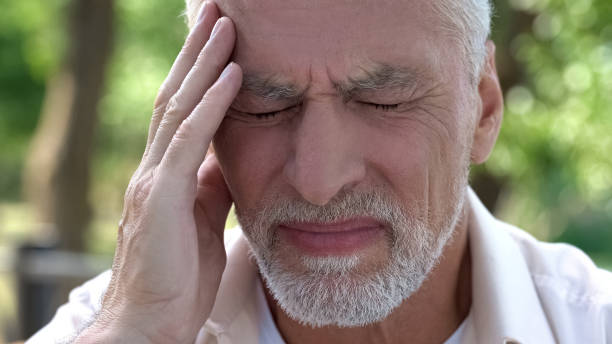 istock Mature man feeling sudden sharp pain in head, migraine attack, risk of thrombus 1127406470