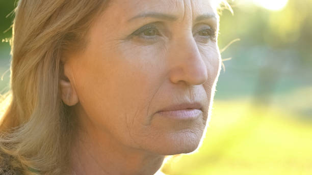istock Pensive old woman thinking about life, plastic surgery and botox, face closeup 1127406868