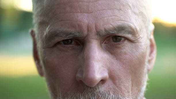 istock Portrait of serious thoughtful man looking into camera, retirement and future 1127407655