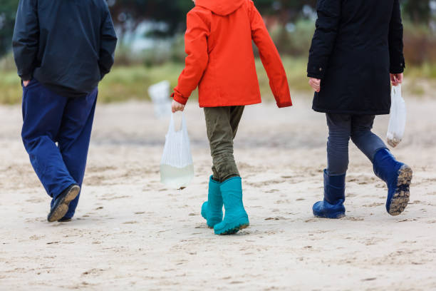 istock man and children walking at the beach 1127408657