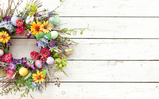Easter spring wreath on an old rustic white wood background