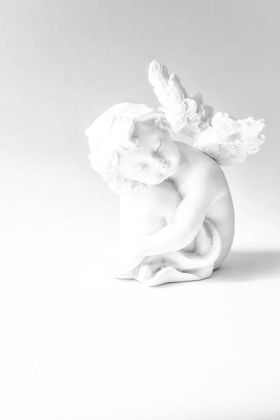 istock Little Angel sit with outspread Wings 1127413881