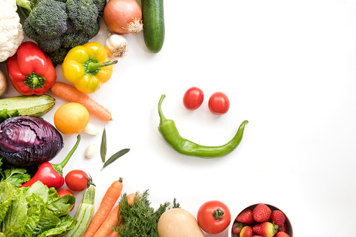 Organic fresh vegetables and fruits frame on white background, top view, copy space