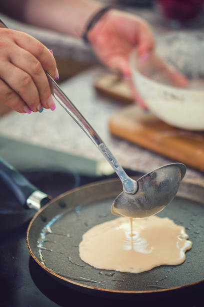 istock Woman Preparing Crepes 1127415077