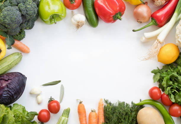 istock Organic fresh vegetables and fruits frame on white background, top view, copy space 1127416260