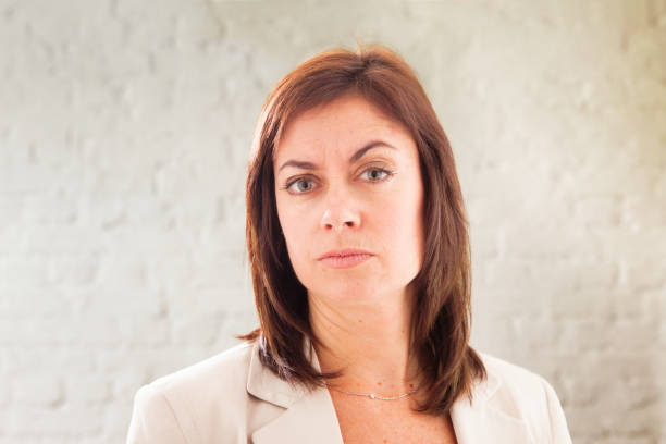 istock Severe businesswoman in her 40s raising a doubtful eyebrow 1127417062
