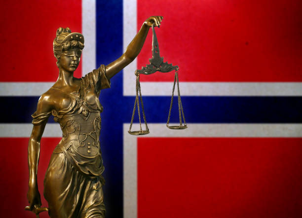 istock Lady Justice before a flag Norwegian flag 1127417339