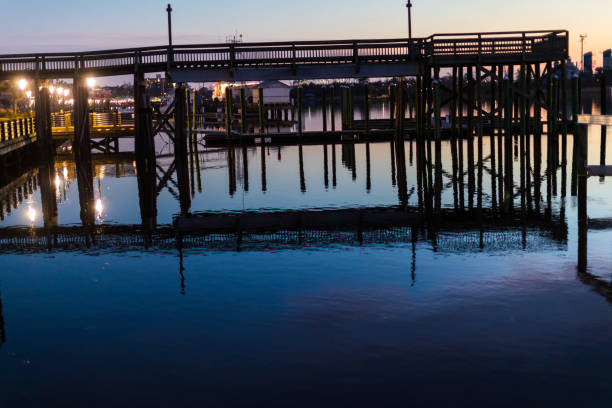 istock wooden deck reflected in the water 1127417398