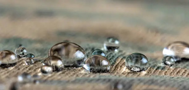 Water droplets on moisture resistant fabric Close up macro