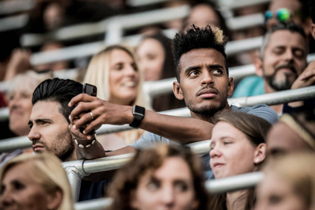 istock African-American man in a stadium crowd 1127427733