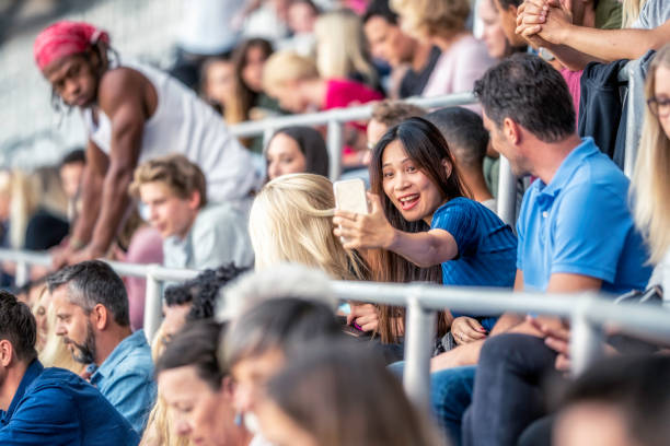 istock Asian woman taking a selfie on a stadium 1127427783