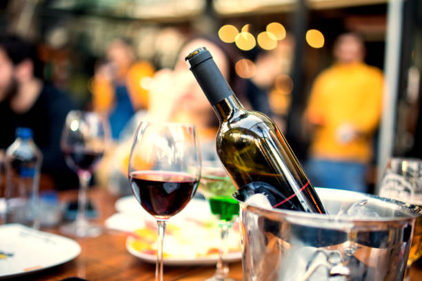 istock red wine on young adults valentines day table 1127428595