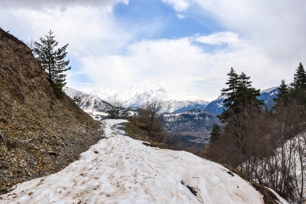 istock panoramic view from the top of the mountains snowy path 1127429541
