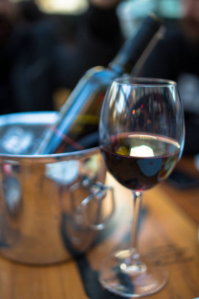 istock red wine on young adults valentines day table 1127429691