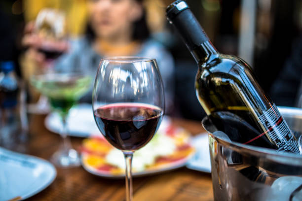 istock red wine on young adults valentines day table 1127430965