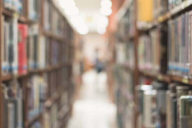 istock Blur school library or study room with book shelves for education background 1127431649