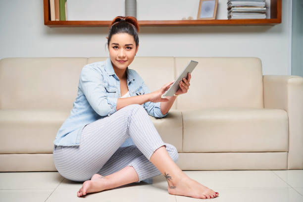istock Woman resting at home with tablet 1127432755