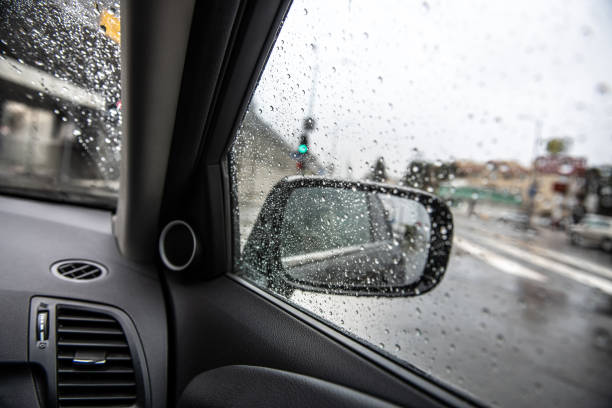 istock Auto Side-View Mirror In Rainy Gloomy Weather 1127434403
